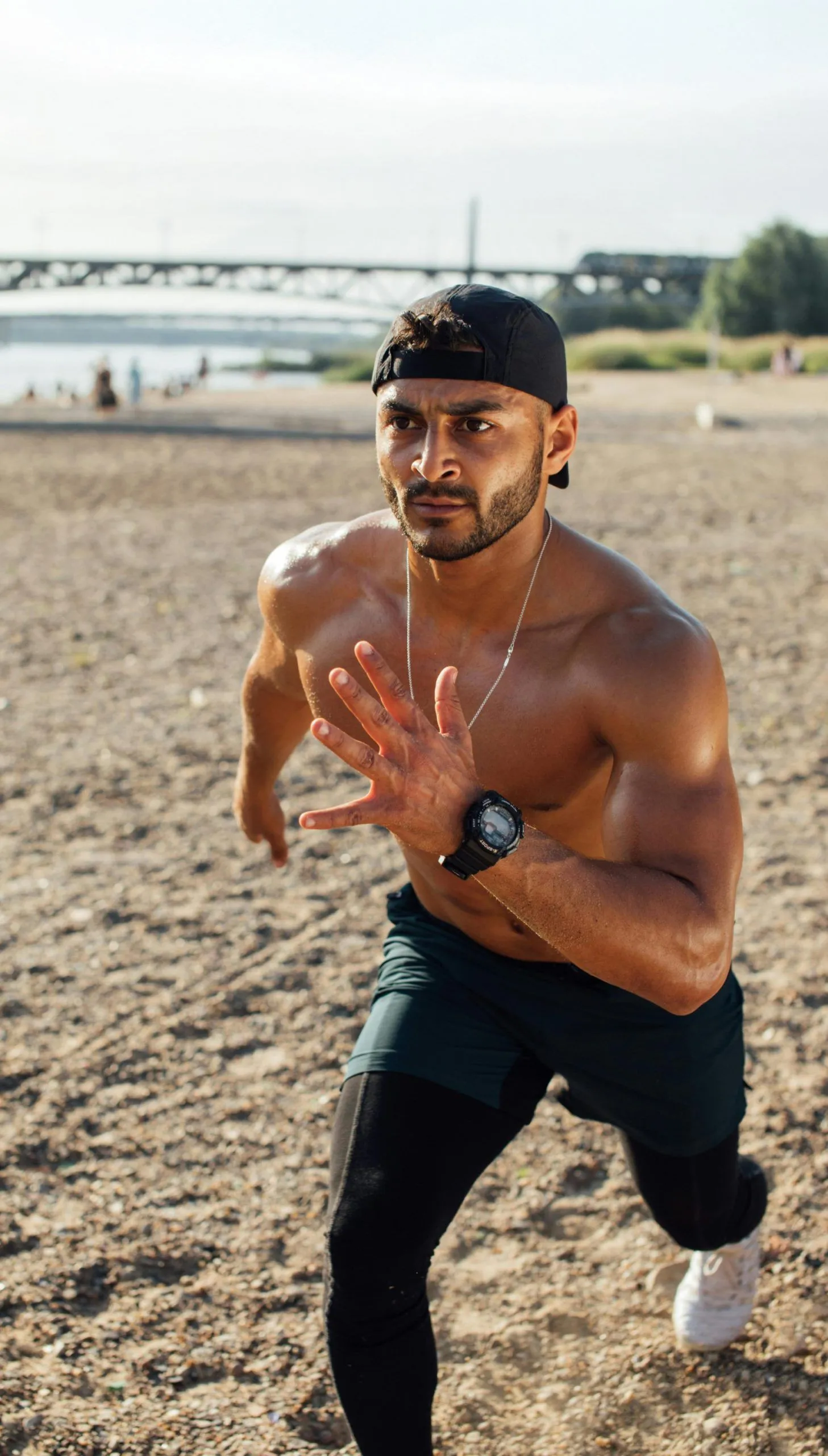 Athlete sprinting on a beach